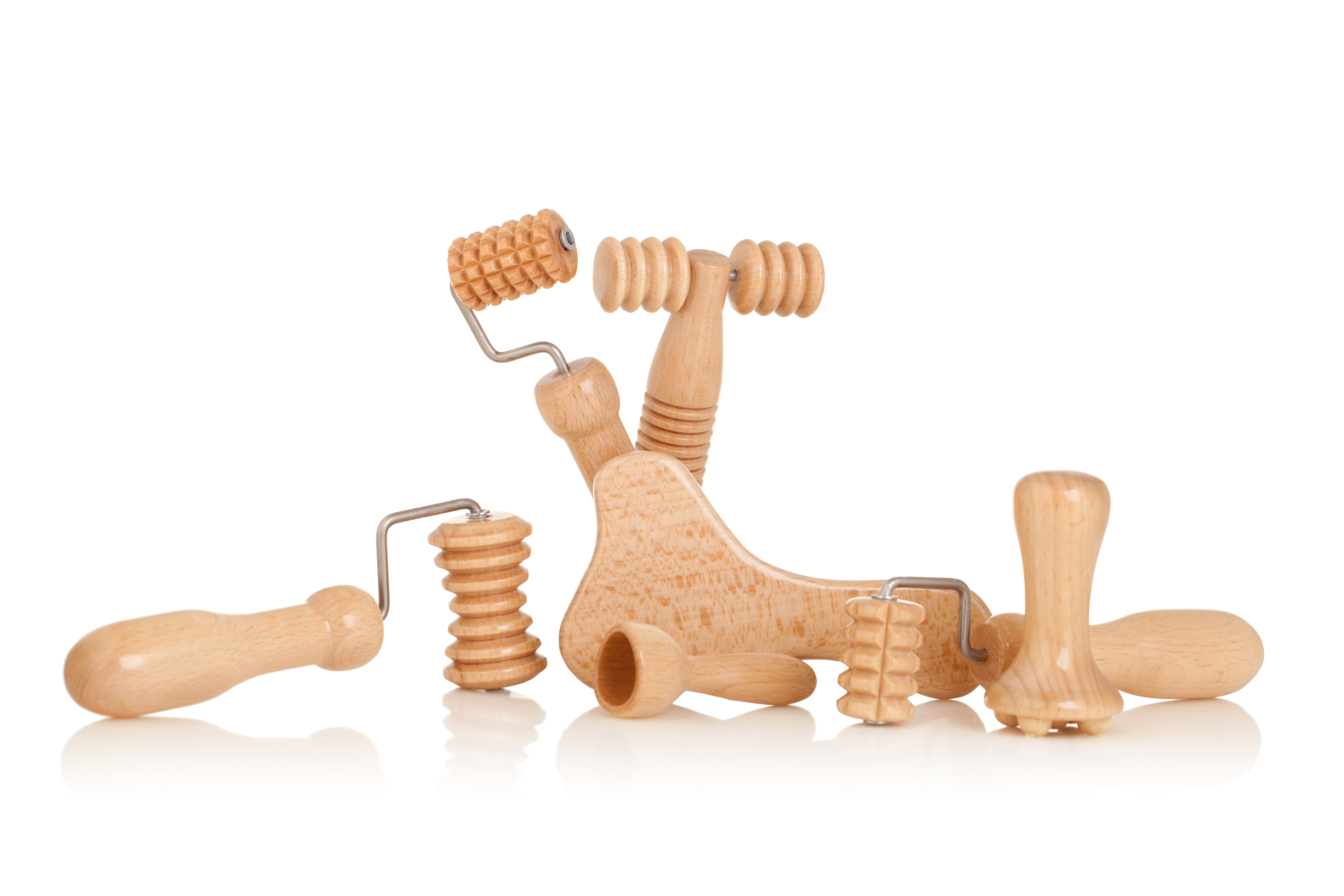 Small wooden massage rollers designed for face, neck, and d&eacute;colletage maderotherapy.